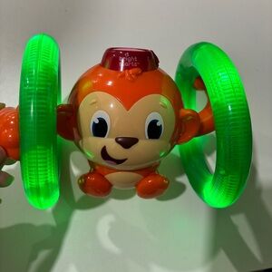 Bright Starts Roll & Glow Monkey Baby Kids Musical Toy With Lightup Wheel